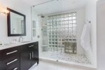 Master ensuite full bathroom, curated just for you. A double vanity sink and frameless shower compliment the sleek and clean space